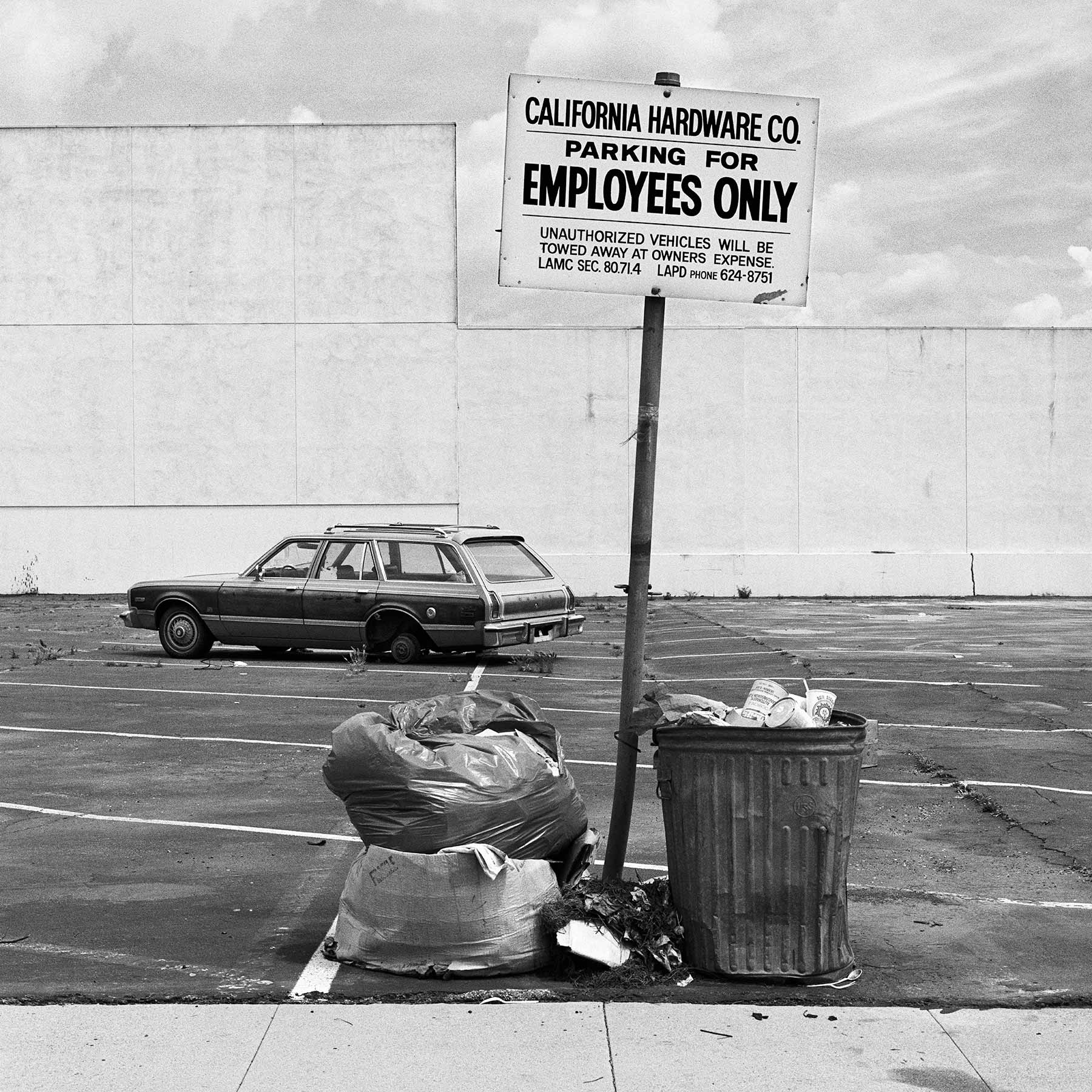 Car with missing wheel – Arts District, Los Angeles, California, 1983
