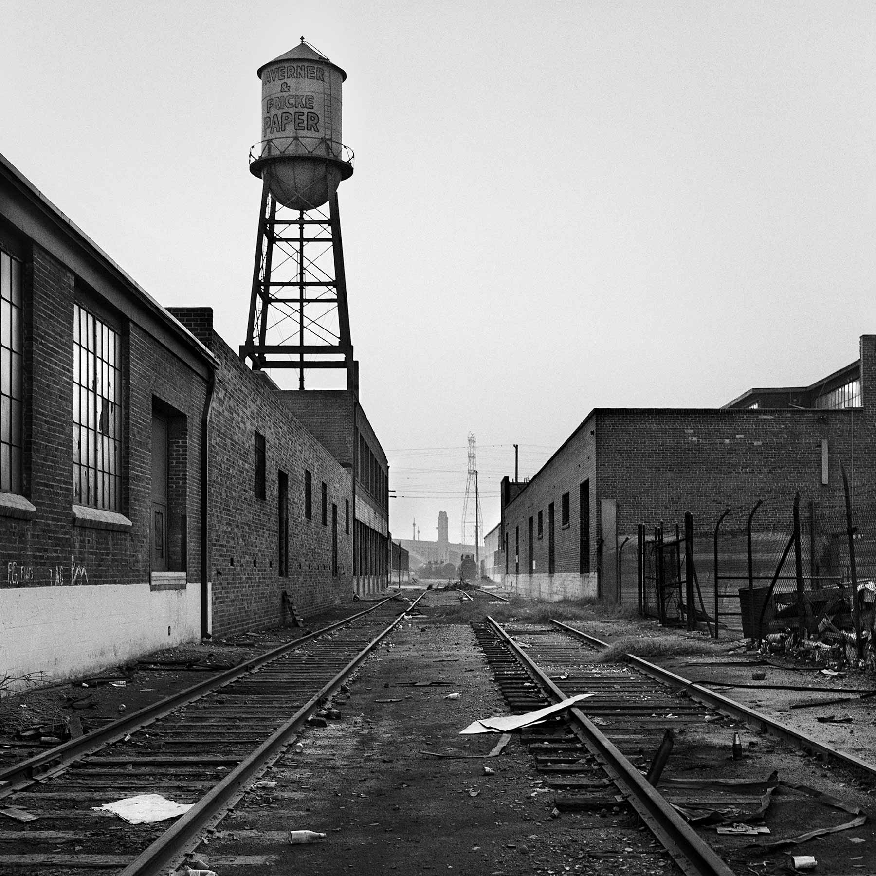 Water tower and littered railroad tracks – Boyle Heights, Los Angeles, California, 1984