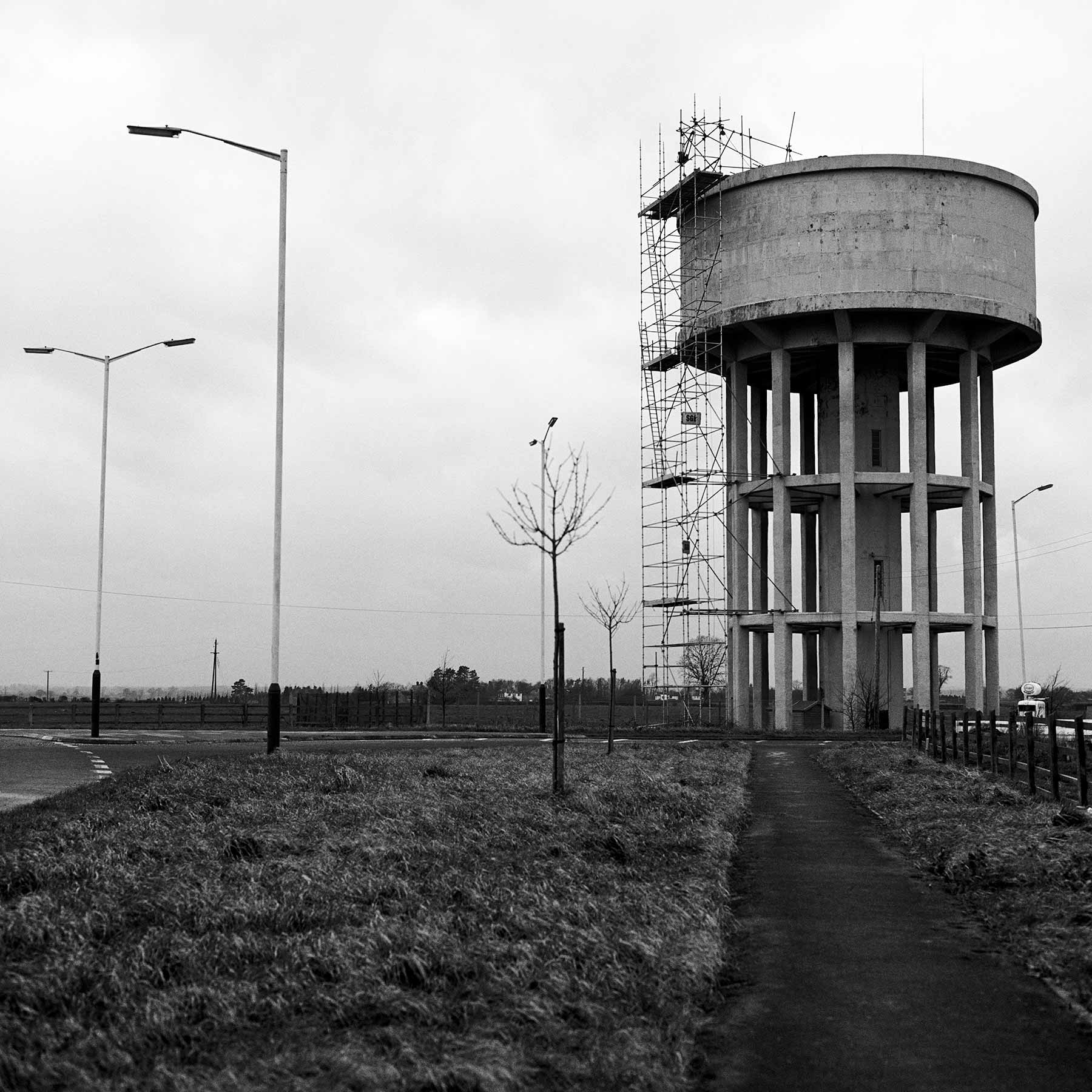 Water tower and petrol station – Malmesbury, England, 1980
